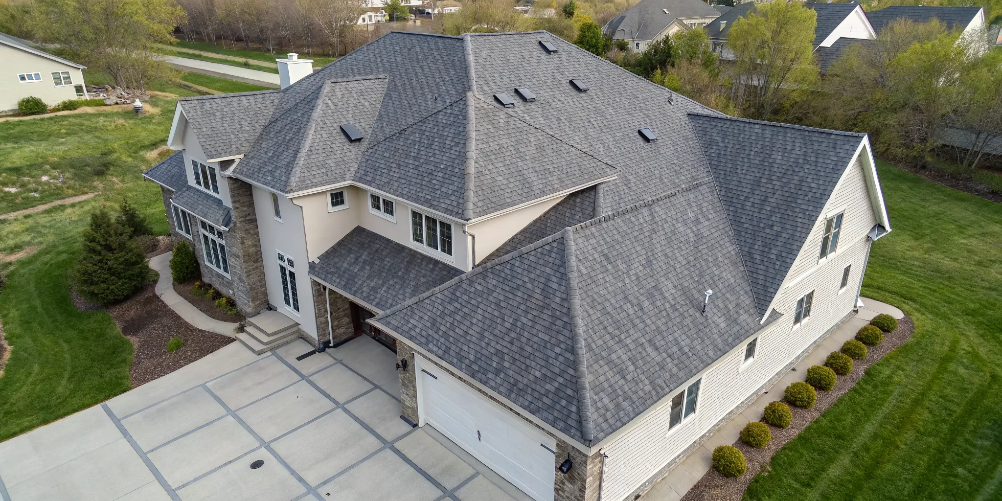 A large, complex asphalt roof, a primary driver of major roof repair cost.