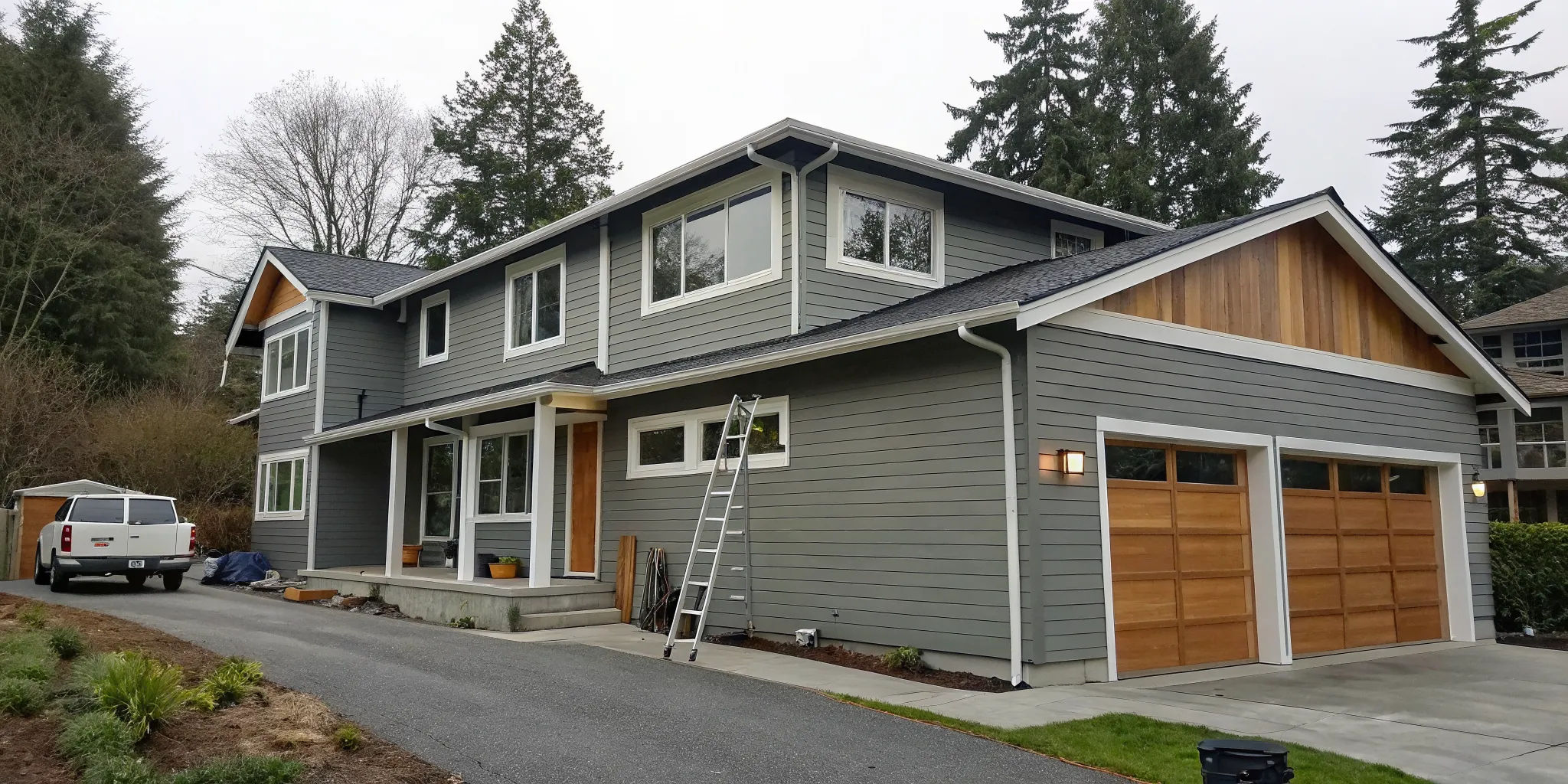 Modern home with gray siding, a result of the best siding repair company in Puget Sound.