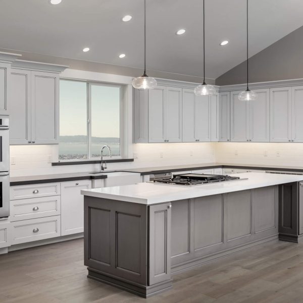 Kitchen painting and cabinet refinishing with neutral tones and clean finishes in an Eastside home
