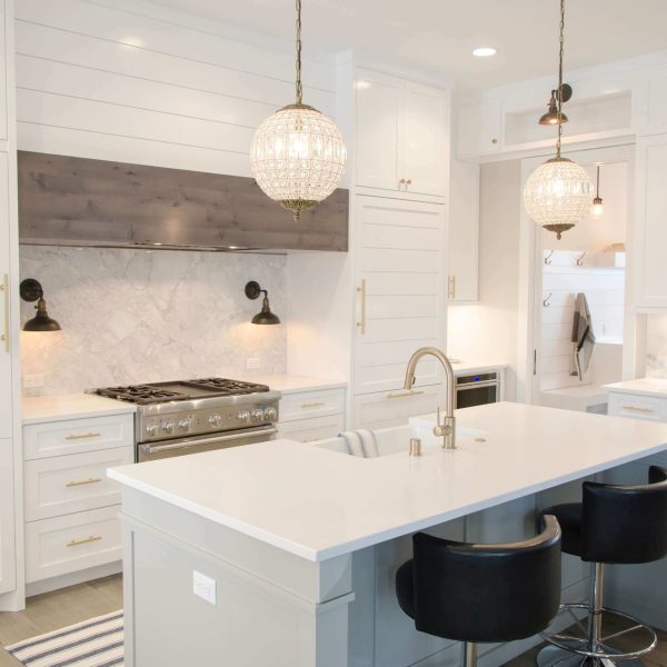 White kitchen interior painting with smooth cabinet and wall finishes in a residential home
